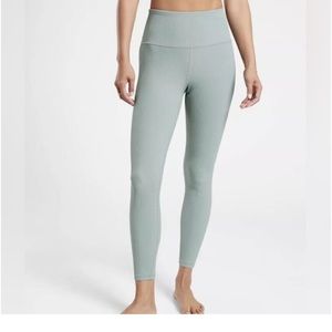 Athleta size small legging. Ribbed material. Minimalist grey color. Green/grey.